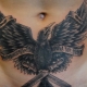 Преглед мушких тетоважа на стомаку и нијансе њихове примене