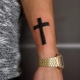 All about men's cross tattoos